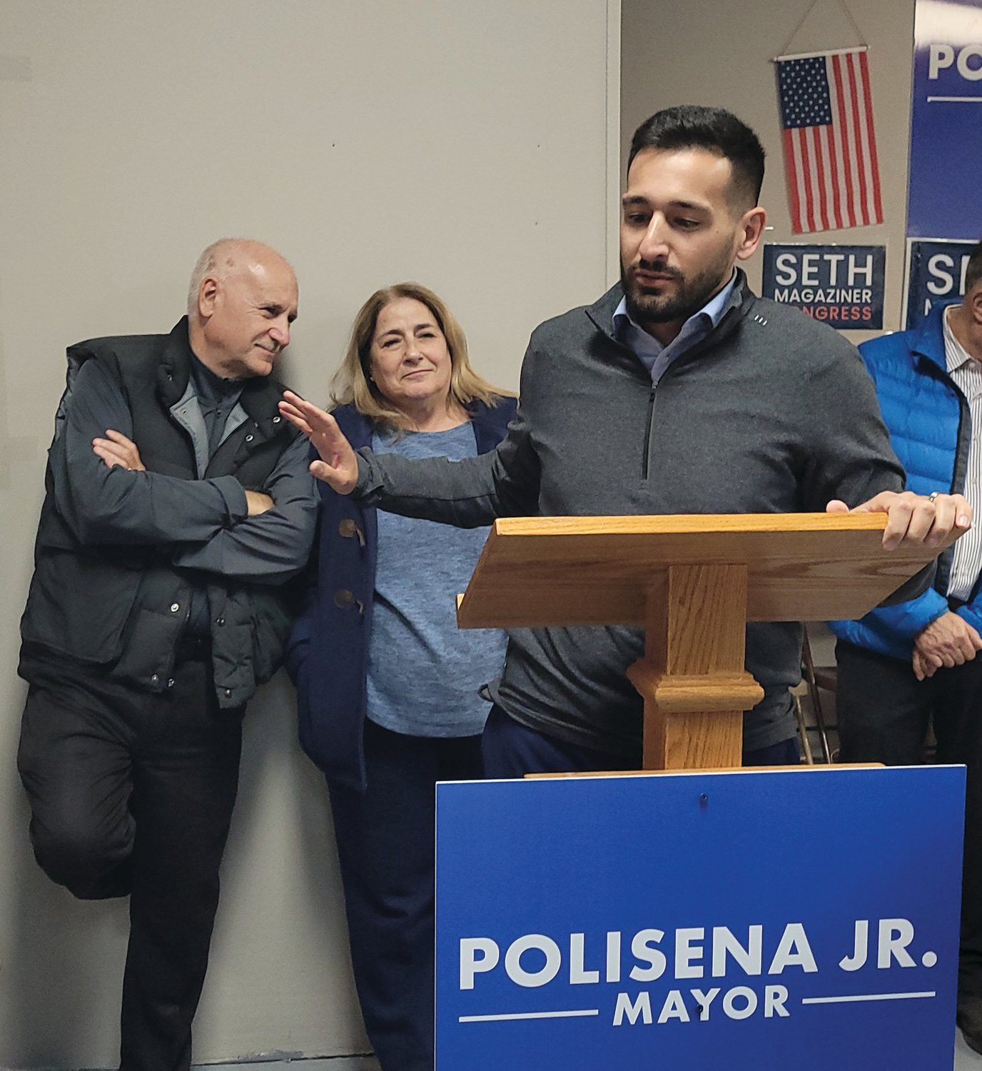 THE TALLY: After his victory margin became “mandate” clear, Mayor-elect Joe Polisena Jr. addressed the crowd as his father, Current Mayor Joseph M. Polisena watched on. (Sun Rise photos by Rory Schuler)